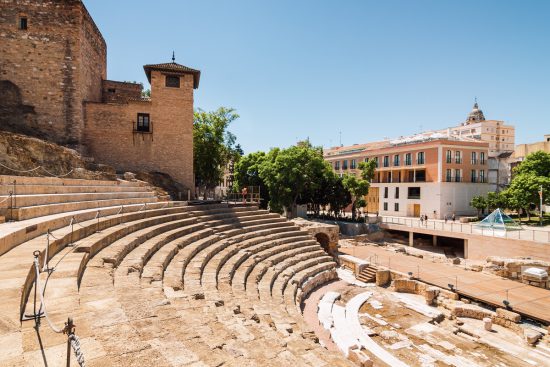 The Roman Theatre with the bustling city of Malaga in the backdrop.