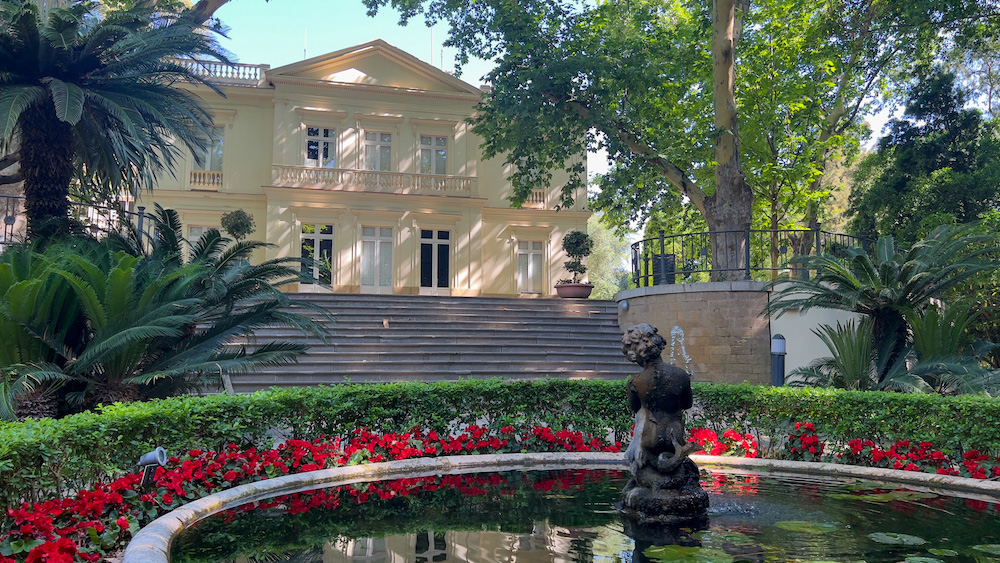Casa Palacio, a historic building within La Concepción Historical-Botanical Gardens in Malaga, Spain.