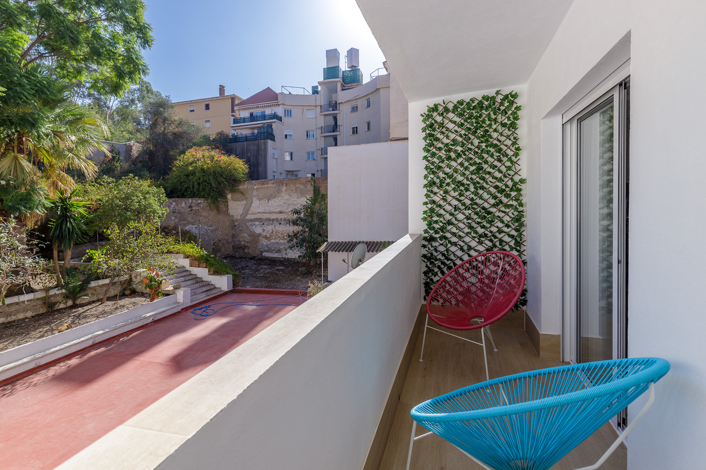 Scenic Balcony with Two Chairs Overlooking Garden and Gibralfaro Mountain in Malaga